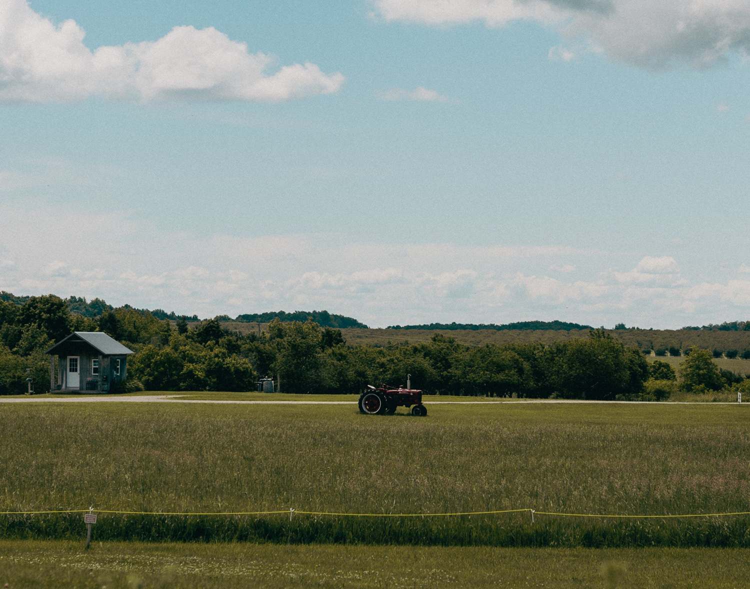 A wide Michigan landscape with a tractor